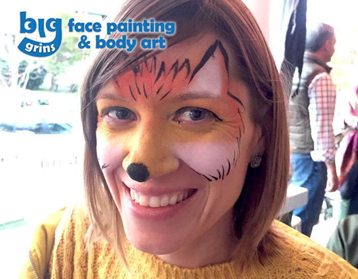 fox face painted on woman for Halloween